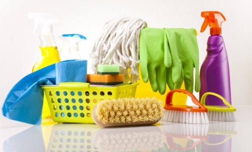Cleaning technician using extraction equipment on carpeting